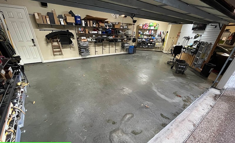 Cracked, stained concrete garage floor